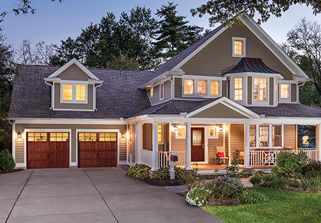 house with arbor grove entry doors and garage doors